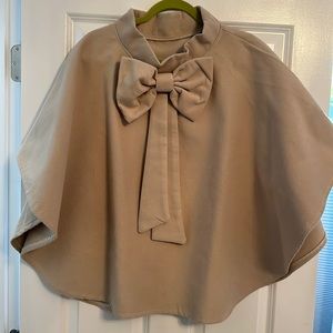 Women’s tan pullover bow cape